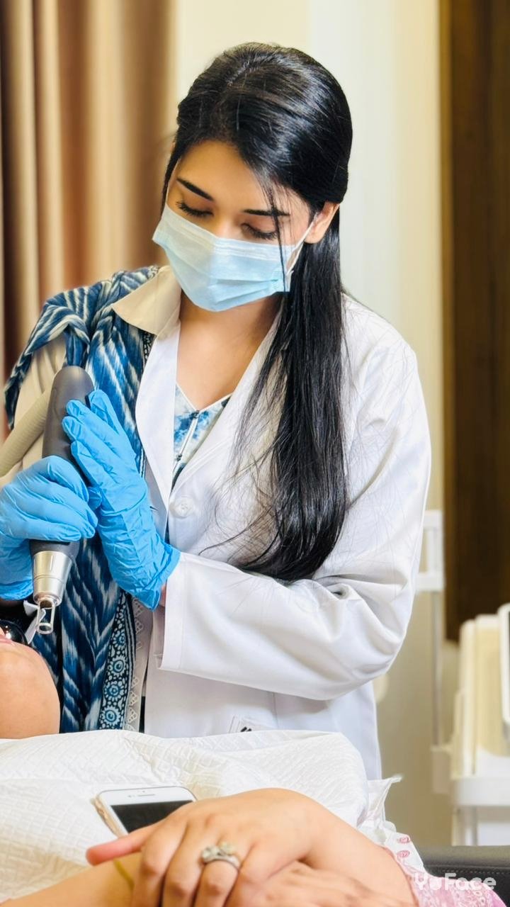 Minahil, certified aesthetician, performing a professional skin treatment